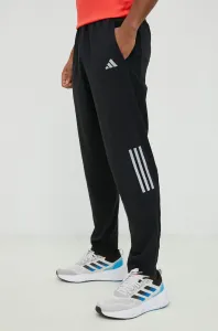 Běžecké kalhoty adidas Performance Own the Run černá barva, s potiskem #6133097