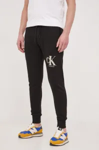 Tepláky Calvin Klein Jeans černá barva, vzorované