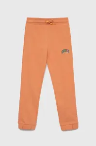 Dětské bavlněné tepláky Guess oranžová barva
